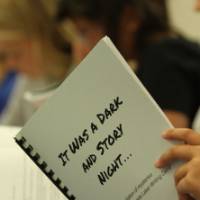 A student holds a packet during a Laker Writing Camp.